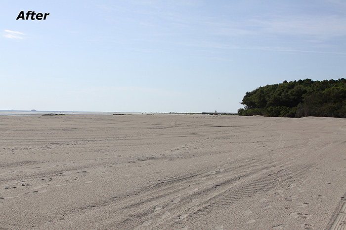 Temporary sand beach access ramp constructed over pipe