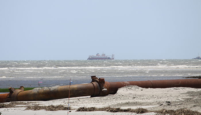 View of Beach Renourishment Dredge in ocean from the beach