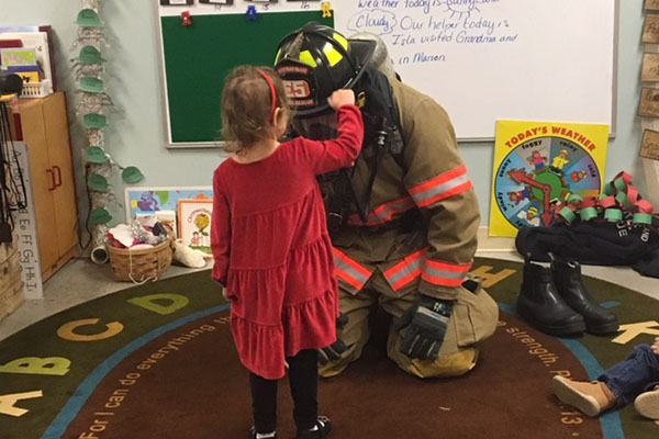 firefigher educating child