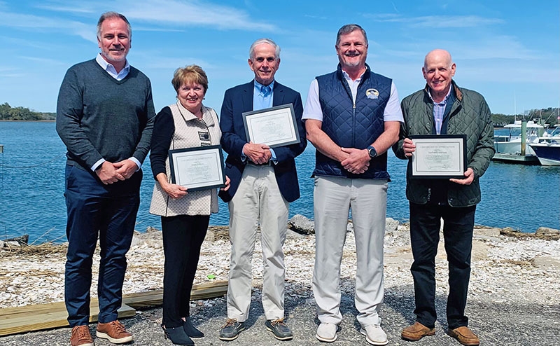 Honored Islanders with Mayor Perry and Marc Orlando in front of ocean view