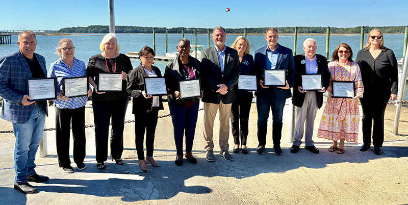 Honored Islanders with Mayor Perry and Marc Orlando in front of ocean view