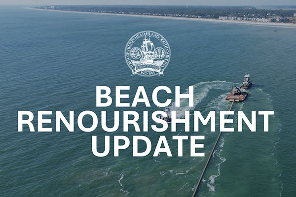 Dredge offshore with pipe leading to land