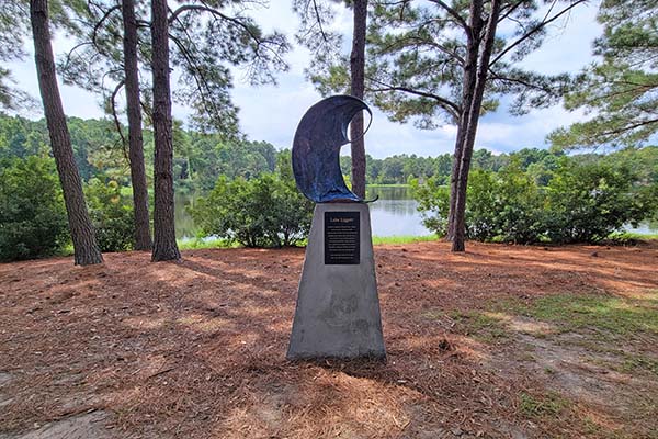 Lake Liggett Sculpture Memorial on the bank overseeing the Lake