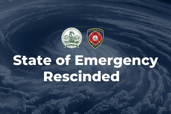 State of Emergency  Rescinded Text over faded hurricane image