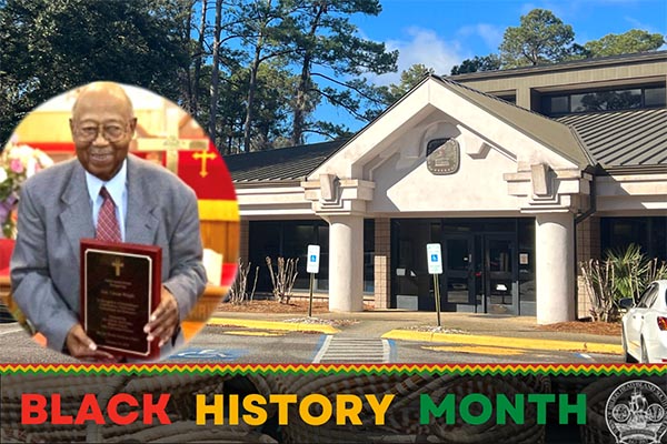 Celebrating Black History Month- Caesar Wright Jr photo beside post office