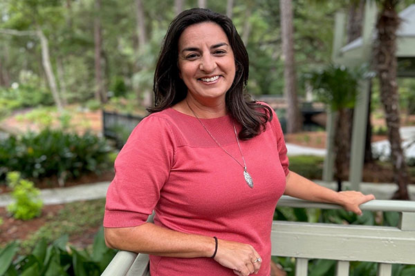 Heather Woolwine standing on deck outside