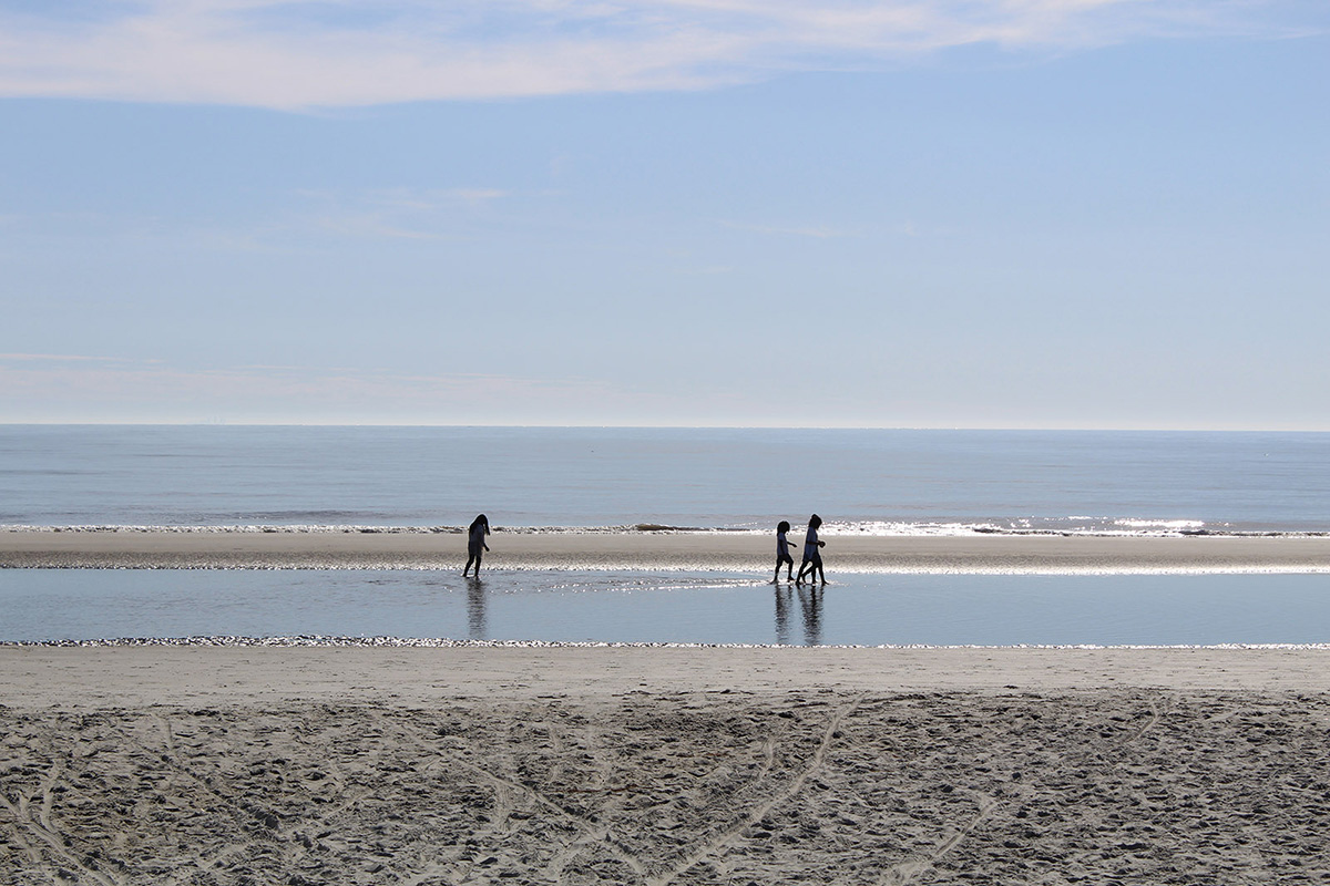 Kids walking on the beach